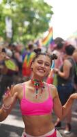 A Colorful Pride Celebration featuring a Vibrant Dancer animatedly moving among Rainbow Flags video