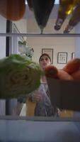 Exploring a Variety of Fresh Ingredients Stored Inside a Refrigerator for Culinary Creativity video