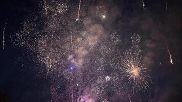 Several Fireworks exploding in the night sky during a celebration photo