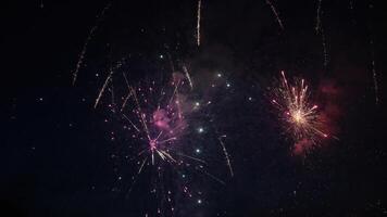 Beautifuil Fireworks exploding in the night sky during a celebration photo