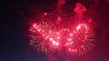 Red Fireworks Exploding in the Night Sky photo