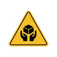 Warning sign carry goods with caution on yellow triangle board. Emergency sign Suitable for posters and web icons vector