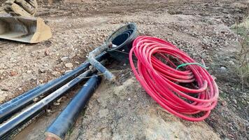 An array of various construction tools expertly laid out on rocky terrain, showcasing essential industry equipment photo