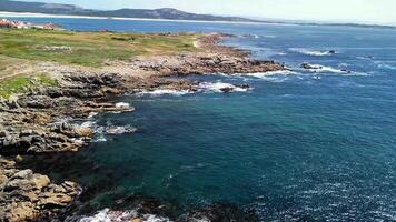 Experience stunning aerial views of rugged coastlines merging with crystalclear blue waters, inviting exploration photo