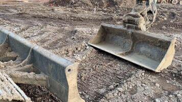 Heavy machinery equipment can be observed at an active construction site, showcasing a variety of excavation tools photo