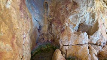 Embark on an adventure to explore the vibrant textures and colors within this magnificent caves interior photo