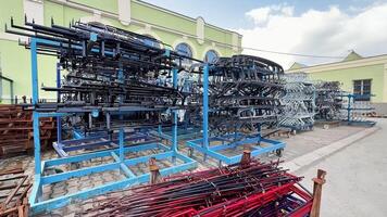 A wellorganized and neatly arranged storage area filled with racks that hold various types of industrial equipment photo