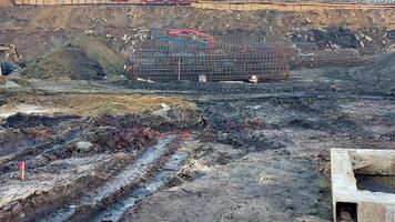 An active construction site that showcases various ongoing activities such as excavation, grading, and foundation work photo
