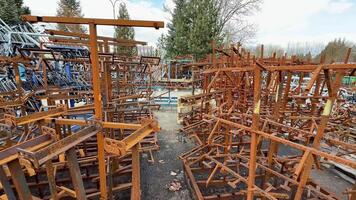 A striking display of rusted metal structures in a scrapyard, showcasing various industrial remnants photo