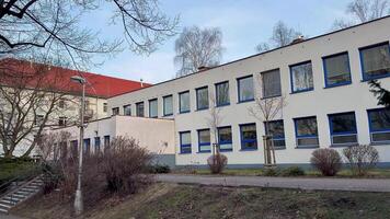 A modern school building showcases innovative architecture integrated with its beautiful natural surroundings photo