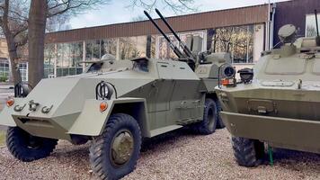 An impressive display of armored military vehicles showcasing a variety of vintage designs and artillery pieces photo