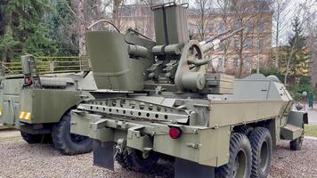 Here is a comprehensive and detailed view of a military vehicle that prominently features an advanced artillery system photo