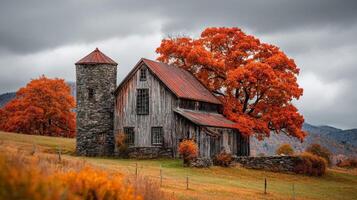 Rustic Wooden Barn with Red Autumn Leaves and Stone Tower photo