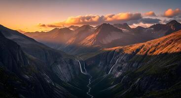 Sunset Over Rugged Mountain Valley with Waterfalls and Dramatic Sky photo