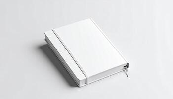 Pocket Size Journal With Elastic Band On White Studio Floor photo