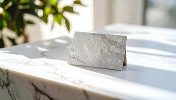Miniature Stone Business Card On White Stone Countertop Rugged Texture Highlight photo