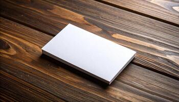 White Cardboard Business Card With Fiber Texture On Dark Wood Surface photo