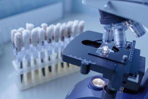 Microscope with Prepared Slide and Test Tubes in Laboratory for Scientific Research and Diagnostics photo