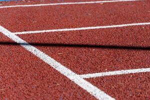 A running track with white lines on it photo