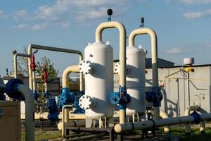 Industrial Gas Processing Plant Featuring Storage Tanks and Pipeline Network Under a Sky photo