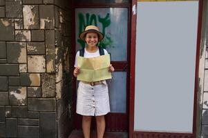 Smiling Tourist Exploring Historic City Alley Holding a Map and Posing Against Rustic Building photo