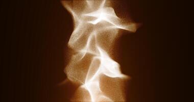 Writhing clouds of yellow particles. Smoke illuminated by a fire. Abstract animation.221 video