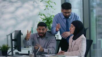 Islamic Arabian Muslim business team colleagues arguing screaming in office misunderstanding discuss online computer work problem quarrel woman in hijab upset two businessmen angry talking bad result video