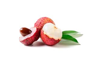 Three Juicy Lychee with cut in half and leaves i photo