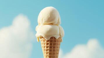 Vanilla ice cream cone against blue sky with two scoops and waffle texture, melting slightly in warm sunlight with soft clouds in the background. photo