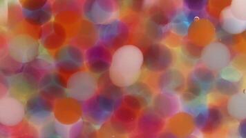 colorida bokeh luzes mudança e embaçamento dentro vibrante abstrato padronizar video