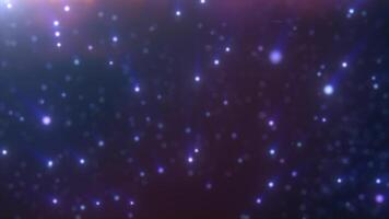 Soft blue and purple glowing light particles floating in the dark, creating a serene and futuristic scene video