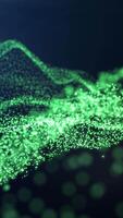 Abstract glowing green particles forming flowing waves against a dark background video