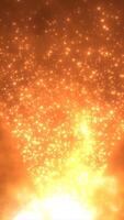 Bright glowing orange particles rising in a flame-like pattern against a warm backdrop video
