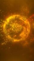 Exploding abstract sphere made of glowing orange and yellow particles in a dark space video