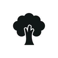 Tree in bold silhouette with leafy crown delivers a strong and timeless green icon. vector