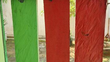Multicolored wooden fence. colorful natural background., yard photo