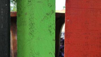 Multicolored wooden fence. Vintage, colorful natural background. photo