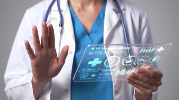 Doctor using a transparent futuristic interface with digital medical data, perfect for illustrating advanced healthcare technology, telemedicine, and modern medical innovation video