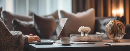 Professional working on laptop with coffee in cozy office space photo