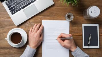 Businessman writing document overhead view modern office professional photo