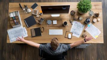 Cheerful individual in well-prepared workspace overhead view lifestyle photo