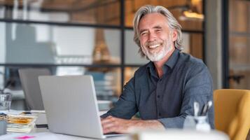 Happy businessman working at modern desk in bright office space photo