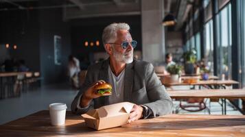 Businessman relaxes during lunch break at modern indoor setting photo
