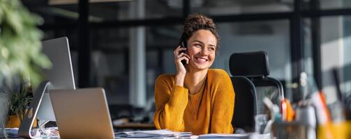 Young professional multitasking at office smiling woman modern workspace photo