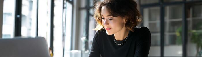 Woman reviewing reports in modern office setting productive environment photo