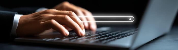 Business professional using laptop for career research in office environment photo