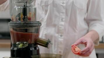 Preparing Fresh Tomato Juice with Modern Juicer in a Cozy Home Kitchen Setting video