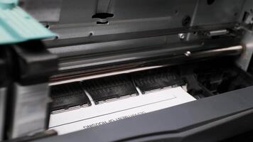 Close-up View of Inkjet Printer Producing Sharp Black Text on White Paper in Modern Office Setting video