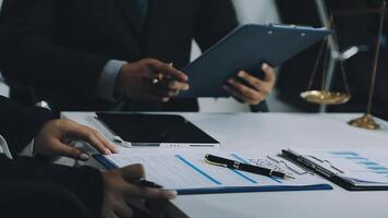 A man in a suit is holding a clipboard while another man is holding a pen video