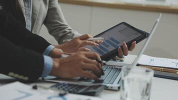 Business people using a tablet computer at a meeting video